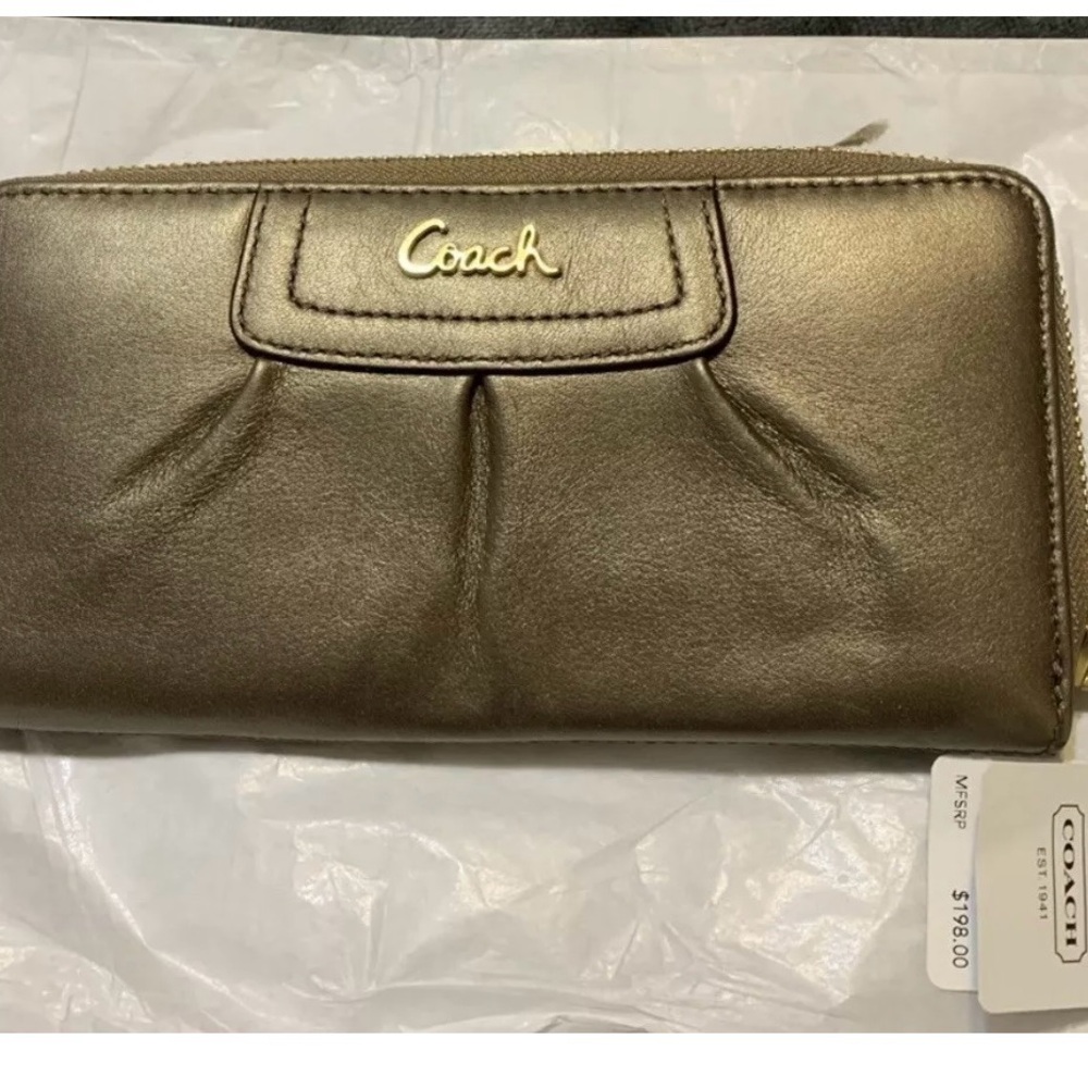 New with original price tag. Coach Gold/Teel zip wallet.